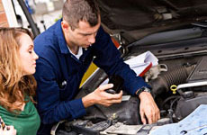 Auto Mechanic Showing Customer Engine | Liskey's Auto & Truck